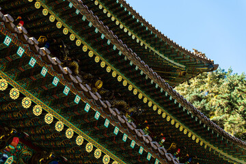 decorated eaves of the traditional Korean building in the Buddhist temple