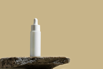 Mockup white matte bottle on the grey rock podium for advertising cosmetic visuals, copy space