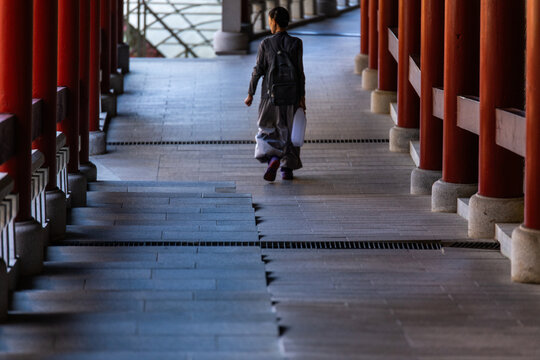 corridor with a tourist in the Buddhist temple