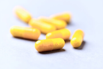 Vitamin C capsules. Bright background. Close up. Copy space.
