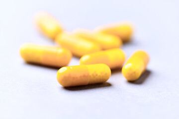 Vitamin C capsules. Bright background. Close up. Copy space.