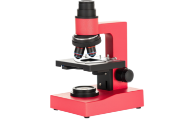 Microscope with red body, white isolated background for clear visibility.