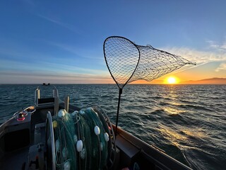 fishing boat at sunset copper river Cordova Alaska 