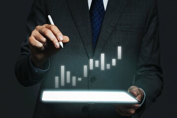 Businessman presenting invisible hologram projecting from tablet advanced technology
