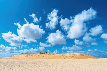 Fototapeta premium Sandy Desert Landscape with Blue Sky and White Clouds