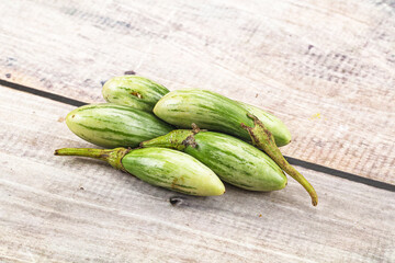 Small organic young green eggplant