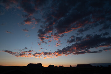 Monument Valley rock formations at sunrise