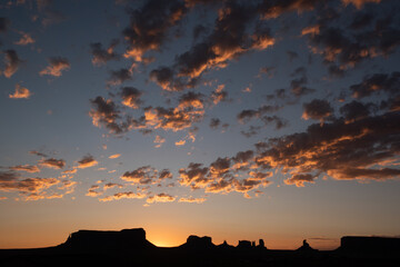 Monument Valley rock formations at sunrise