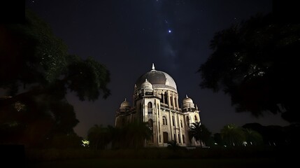 Obraz premium An Ornate Domed Building Stands Tall Under a Starry Night Sky
