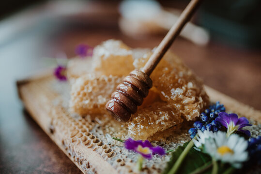 Wooden honey dipper stick closeup