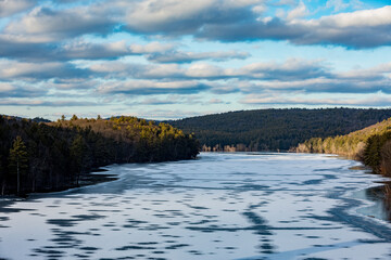 Reservoir beginning to freeze during the onset of winter