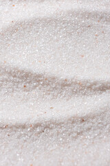Natural Himalayan Pink Salt Fine Ground Top View Abstract Texture Vertical Background