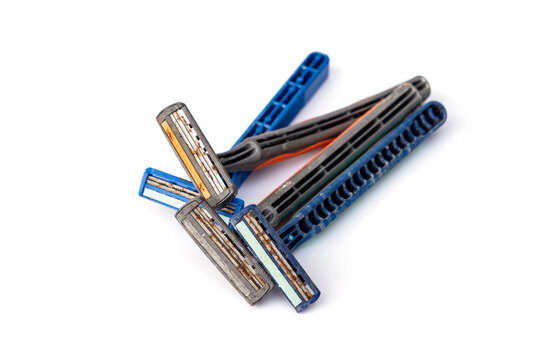 An old expire razor with a rusty blade that has been used before. It is dangerous to reuse it because it can cause cuts and tetanus should be thrown away. isolated on white background.