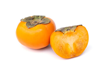 Sweet and crunchy ripe Persimmon Cut in half isolated on white background.