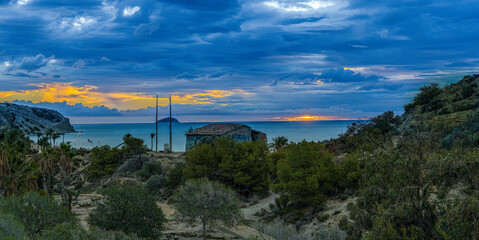 the rising sun between the clouds