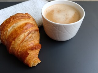 croissant and coffee on the table 