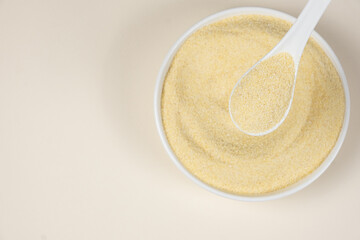 Uncooked durum wheat semolina close-up top view place for text