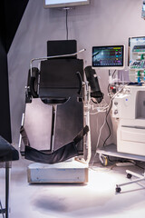 Multifunctional medical examination chair with patient status monitor.