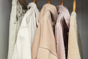 Closeup of texture of beige, cozy and minimalistic clothes capsule