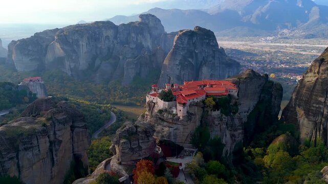 Panoramic aerial sunrise view of the valley, mountains and monasteries of Meteora, Kalampaka, Greece