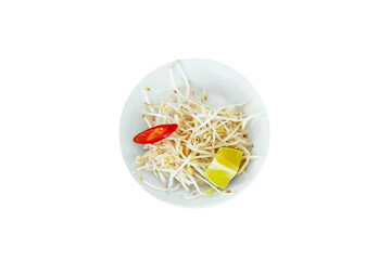 Raw bean sprouts on a white plate with lime slices and red hot pepper. Top view. Isolate. White background.