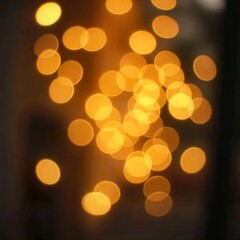 The background is sparkling with golden bokeh and soft focus, creating a glowing light effect