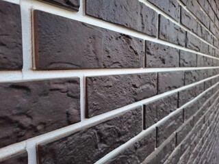 siding in the form of a brick wall. house construction, wall covering