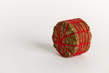 Thai Stick Cannabis marijuana on white background, Red thread Thai stick marijuana flower