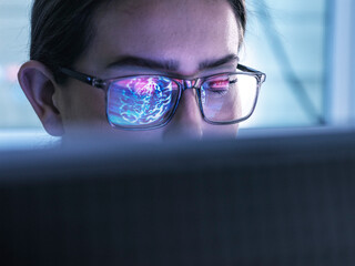 Doctor researching on brain MRI and using computer with AI technology