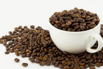 Fototapeta premium Cup of coffee on white . beverage drink concept. white cup of coffee with green beans stands on a white . a man standing on a white with a cup of coffee and beans lifestyle.