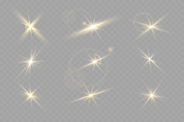A set of golden stars, sun rays and dawn effect. Glare. An explosion on a transparent background. Sparkling particles of magic dust. A bright star. Transparent glowing sun, bright flash