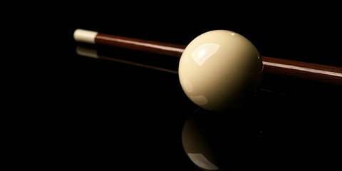 A pool ball rests on a pool stick