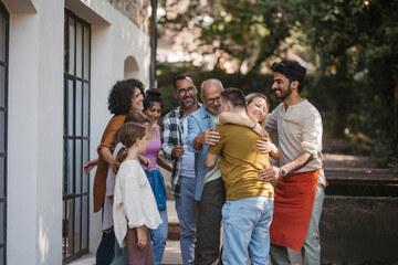 Diverse group of community members embracing successful community project