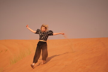person jumping in the desert
