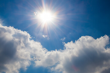 Sun, clouds, glare in the sky. Sky nature blue concept. Nature, clouds, blue sky, sun, moon. Sun, clouds, glare, blue sky, nature lifestyle.