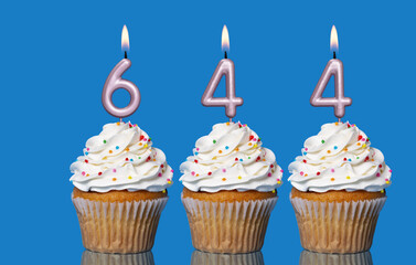Birthday Cupcakes With Candles Lit Forming The Number 644