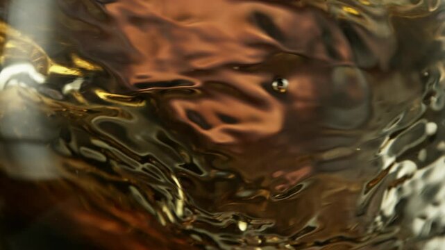 Super Slow Motion Macro Shot of Spinning White Wine in Glass at 1000fps.