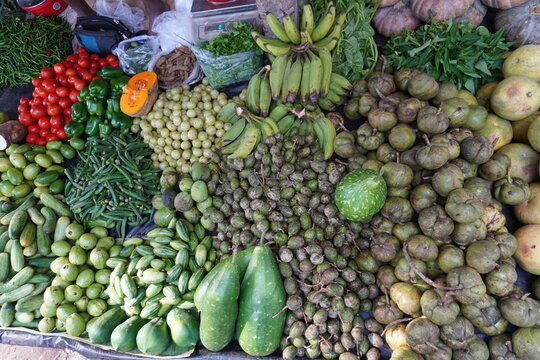 Variety of vegetables in the vegetable store like raw bananas, amlas, bottle gourd, pointed gourd, pumpkins and many others 