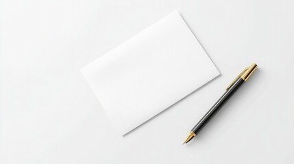 A blank white card and a black pen with gold accents on a white background, perfect for a simple and elegant design.