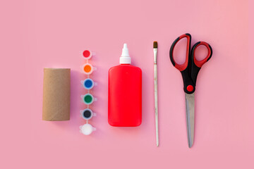 DIY crafts for kids, toilet tube roll, glue, paper, scissors, paint and brush. How to make Christmas, Halloween, Easter, School day toys concept. eco, zero waste. handmade flat lay composition