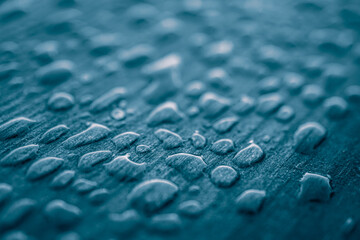 raindrops on the wooden surface, blue background, rainy days