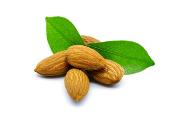 Close up of almonds with leaves, isolated on white background