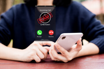 Phone Scam, fraud or phishing concept.Unknown caller show on mobile phone screen.