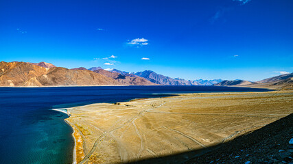 Pangong Lake is an inland lake in the Himalayas, at an elevation of 4,350 m (14,270 ft) above sea level. It is 134 km (83 mi) long and crosses the border between India and the Tibet Autonomous Region.