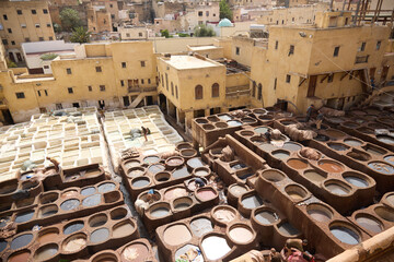 People works in the Shuara leather dyeing factory. Traditional Moroccan craft.