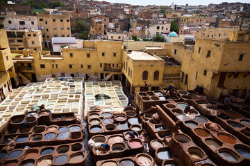 People works in the Shuara leather dyeing factory. Traditional Moroccan craft.