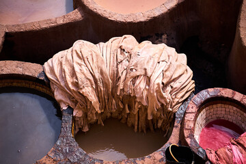 People works in the Shuara leather dyeing factory. Traditional Moroccan craft.