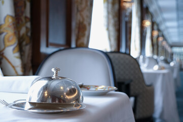 Formal and elegant ocean view dining room restaurant onboard luxury cruiseship or cruise ship liner...