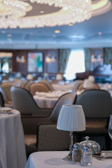 Formal and elegant ocean view dining room restaurant onboard luxury cruiseship or cruise ship liner...