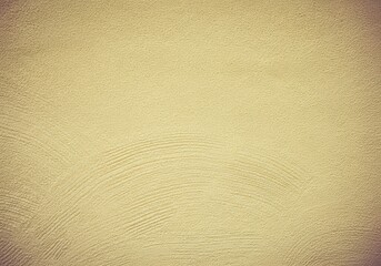 Obraz premium Textured yellow plaster with subtle swirl patterns
